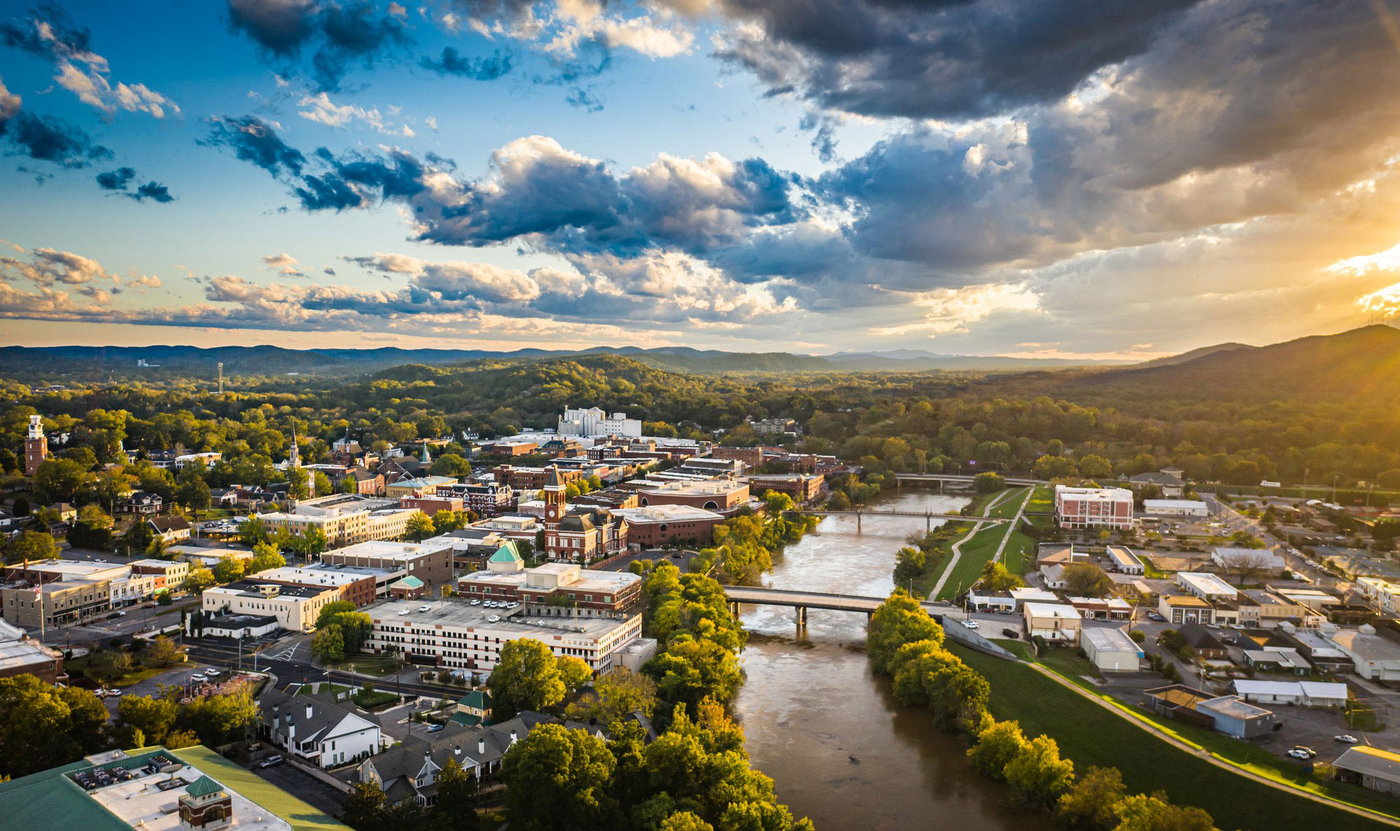 Aerial view of Downtown Rome, Georgia, the rivers, bridges, and surrounding mountains